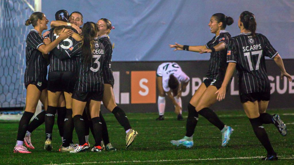 BKFC teammates celebrate on the field against Lexington SC