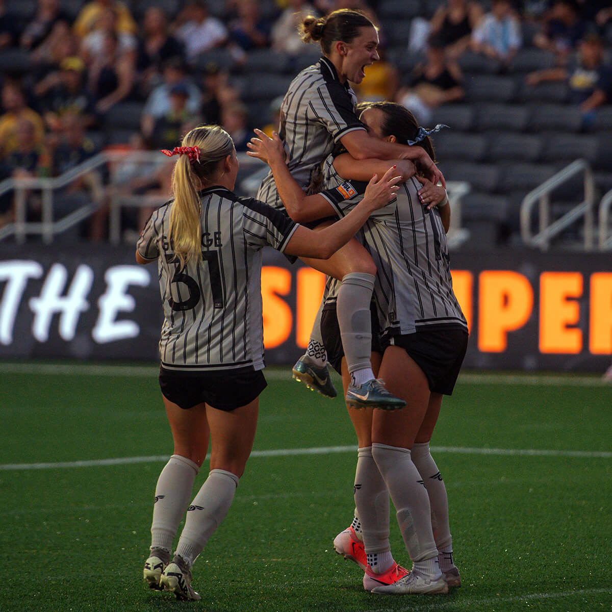 BKFC Women's Team players celebrate a goal